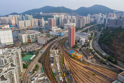 High angle view of traffic on road amidst buildings in city