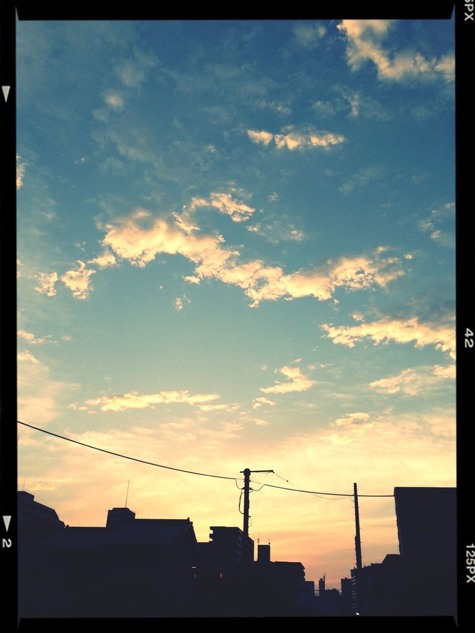 sunset, silhouette, building exterior, architecture, built structure, sky, low angle view, transfer print, orange color, cloud, city, cloud - sky, auto post production filter, power line, building, residential structure, high section, outdoors, house, no people