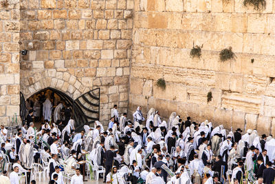 Group of people in front of historic building