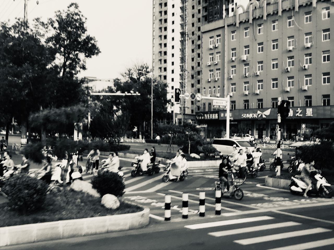 GROUP OF PEOPLE CROSSING STREET