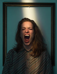 Portrait of beautiful young woman at home