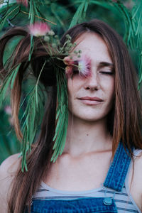 Close-up of woman against trees