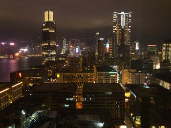 Aerial view of illuminated buildings in city at night