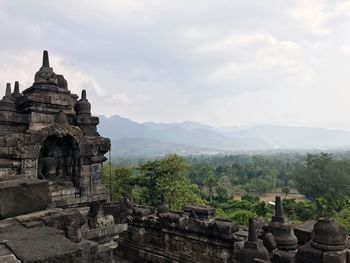 View of temple against cloudy sky