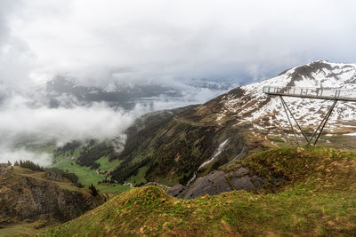 Grindelwald first cliff walk viewed from on top of the summit mountain in grindelwald, switzerland.