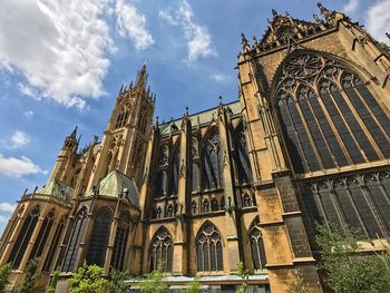 Low angle view of cathedral against cloudy sky