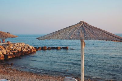 View of thatched umbrella on the beach