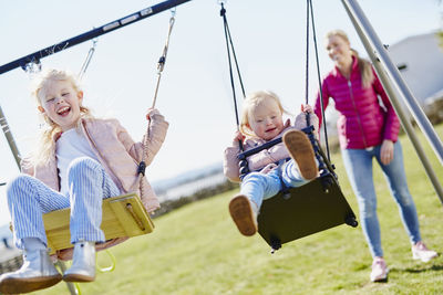 Girls swinging on playground
