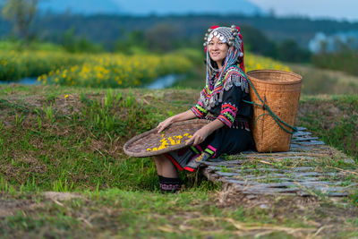 Woman sitting on field