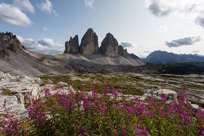 Scenic view of mountains against cloudy sky