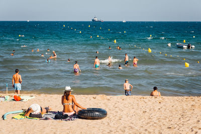 Crowd of people enjoying at beach