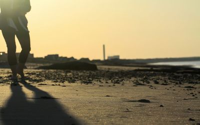 Silhouette of woman at sunset