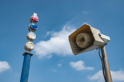 Low angle view of street light against sky