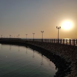 Scenic view of sea against clear sky during sunset