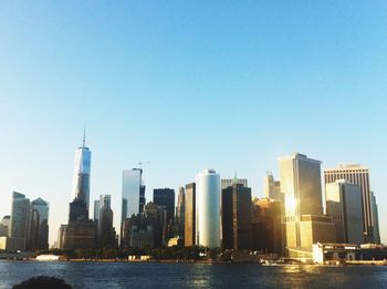 Modern buildings in city against clear sky
