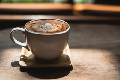 Close-up of cappuccino on table