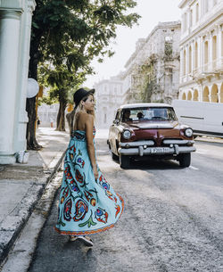 Woman standing on street in city