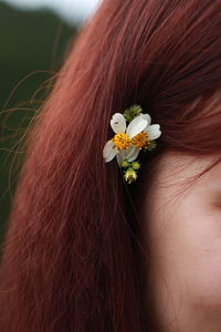 Close-up of woman with flower hair