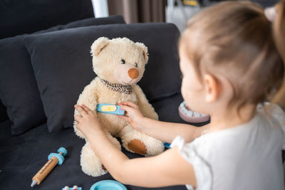 Close-up of cute girl with stuffed toy