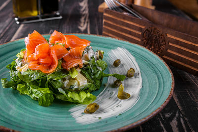 High angle view of fish in plate on table