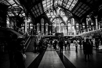 People walking on railroad station platform