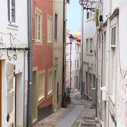 Narrow street amidst buildings in city