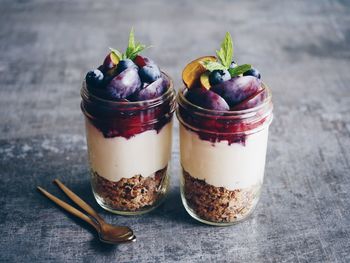 Close-up of dessert in containers on table