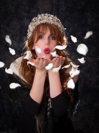 Portrait of young woman in hat