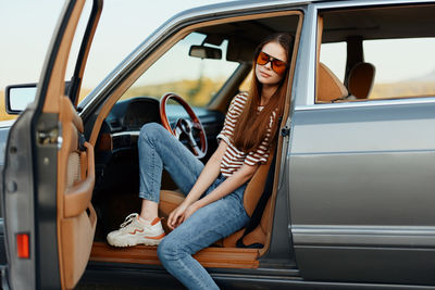 Low section of man driving car