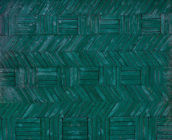 Pattern from wooden planks painted in green. wooden wall texture or background.