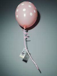 High angle view of balloons on table against wall