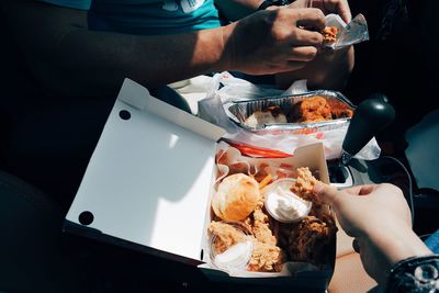 Close-up of people having food