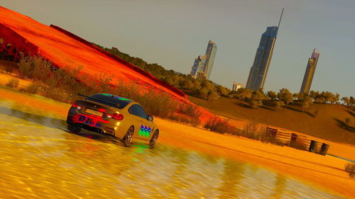 View of car on water against sky