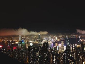 High angle view of illuminated city buildings at night