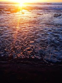 Scenic view of sea against sky at sunset