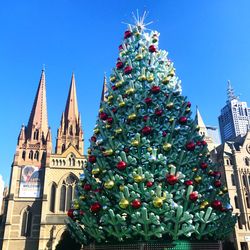 Low angle view of christmas tree against sky