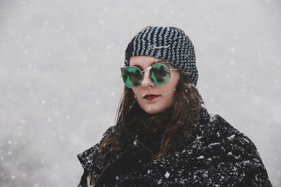 Portrait of young woman in snow