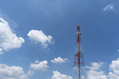 Low angle view of communications tower against sky