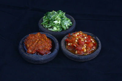 High angle view of food on table against black background