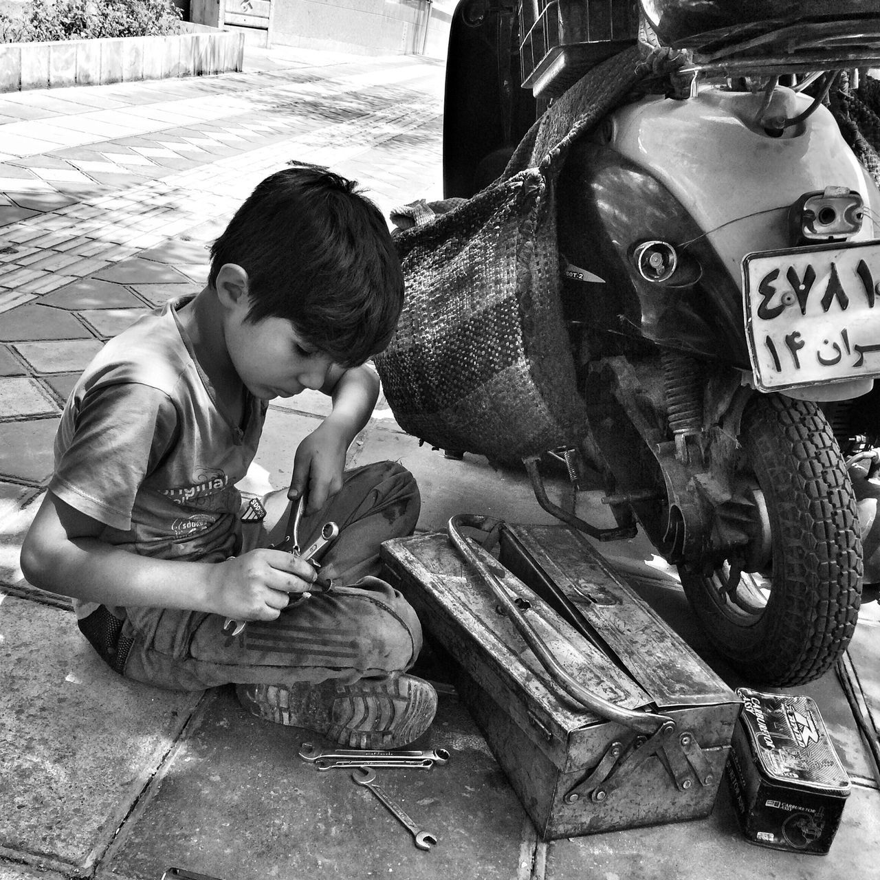 lifestyles, casual clothing, leisure activity, childhood, transportation, land vehicle, men, street, sitting, togetherness, full length, mode of transport, day, person, boys, outdoors, elementary age