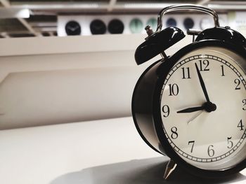 Close-up of clock on table