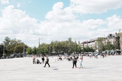 People on town square against sky