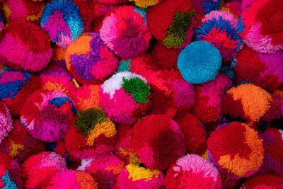 Full frame shot of multi colored pom poms