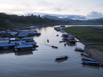 High angle view of boats moored in sea against sky