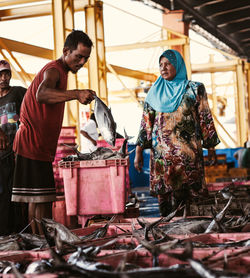 Man working at market stall