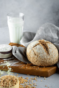 Homemade loaf of freshly baked green buckwheat bread and organic buckwheat milk. 