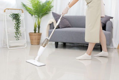 Low section of woman standing on floor