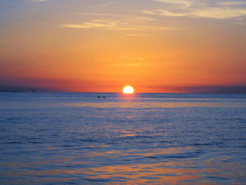 Scenic view of sea against sky at sunset