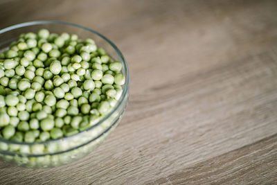 High angle view of green beans in bowl on table