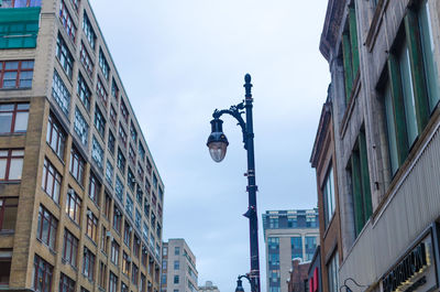 Low angle view of street light against sky